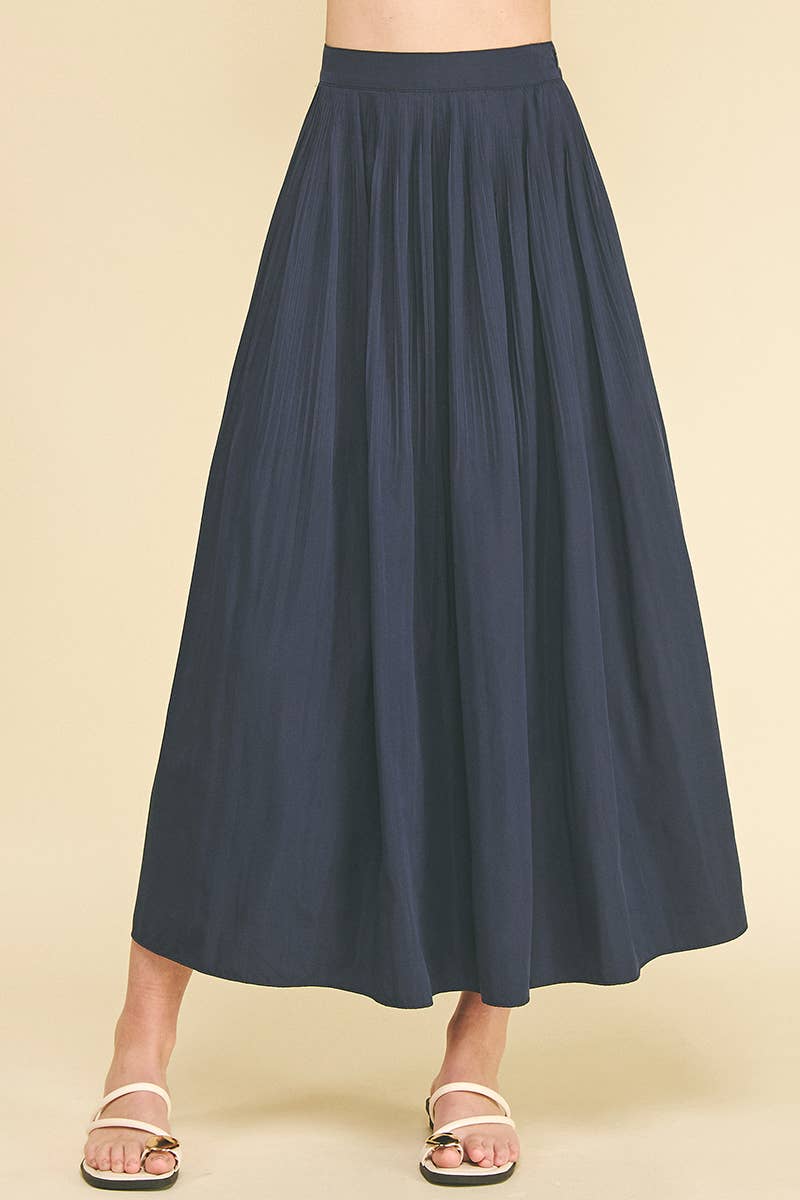 Bess Skirt in Deep Navy — front view showing pleat detail