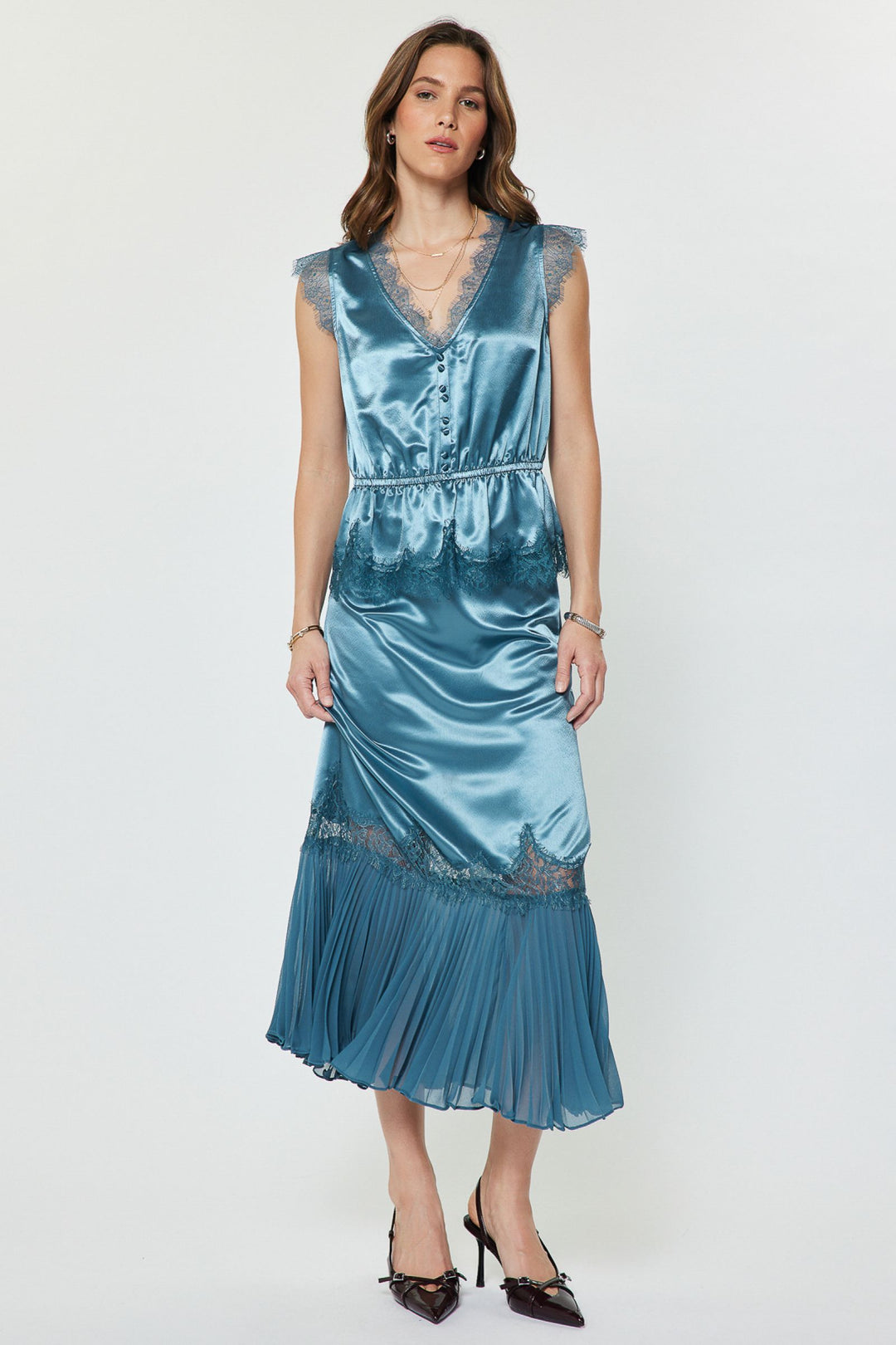 Ainsley Set in Dusty Blue — metallic satin lace peplum top worn with the matching high-waist midi skirt