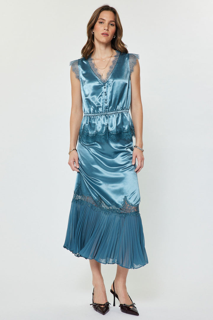 Ainsley Set in Dusty Blue — metallic satin lace peplum top worn with the matching high-waist midi skirt