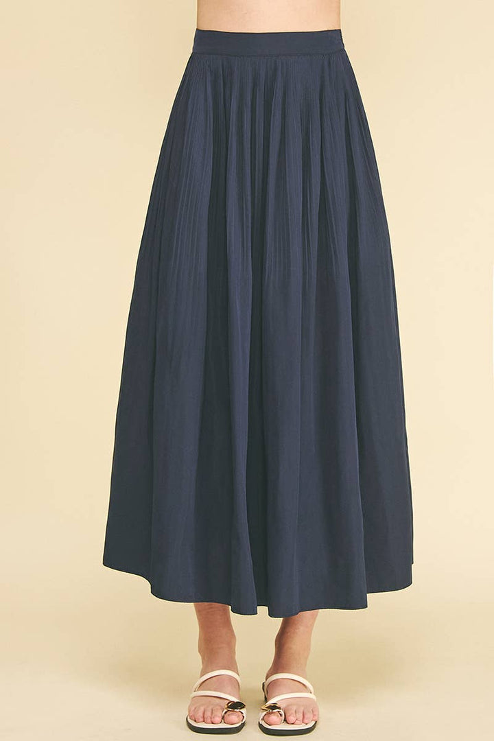 Bess Skirt in Deep Navy — pleated A-line midi skirt